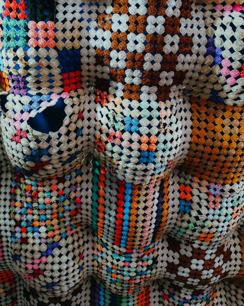 Brightly colored crocheted patchwork textile