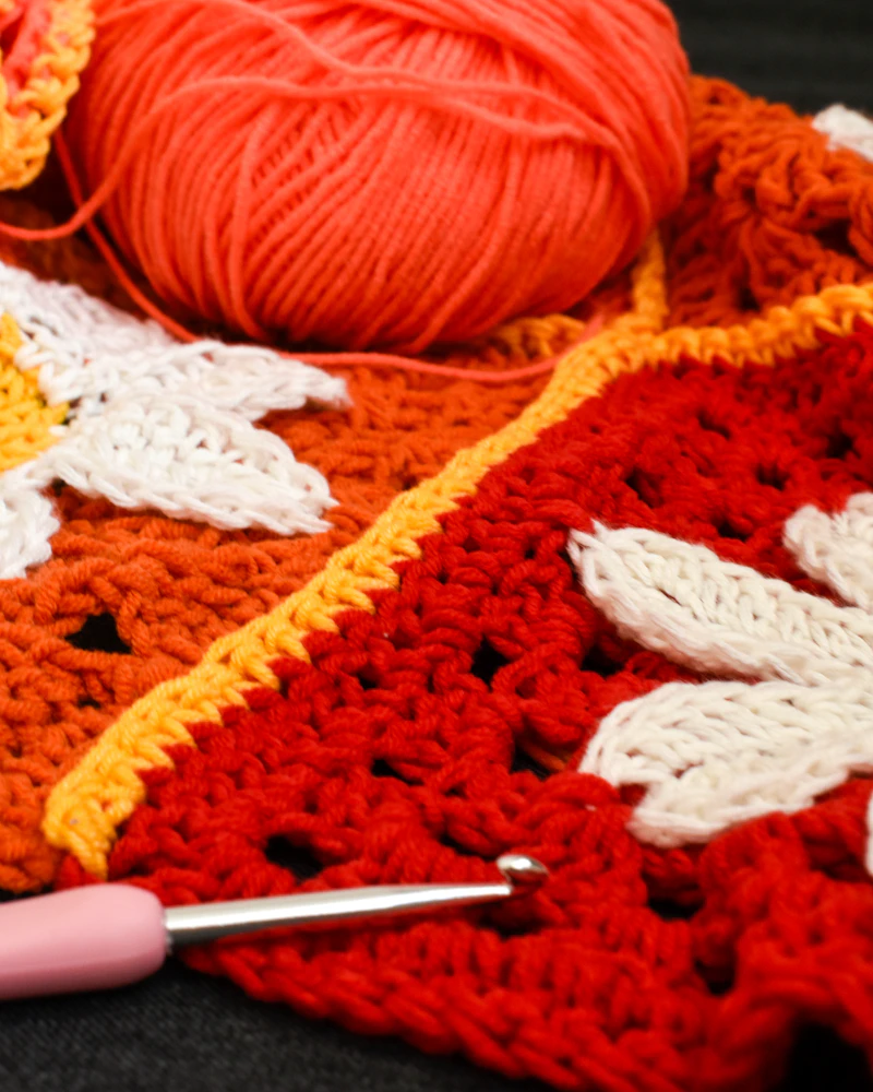 Crocheted squares with yarn and hook